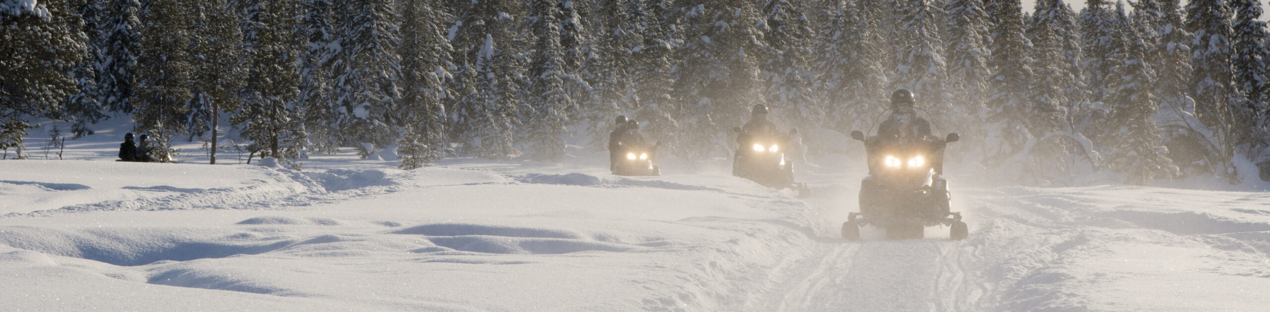 Group of people on snowmobiles, Jukkasjarvi, Sweden